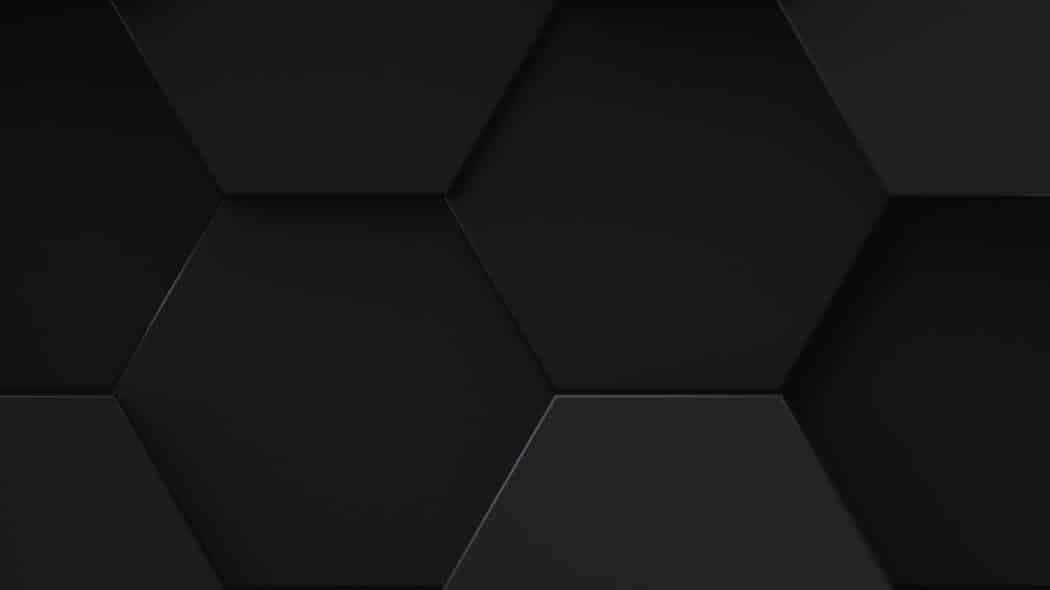Seamless dark hexagonal pattern with subtle shadows creating a modern and structured 3D texture.