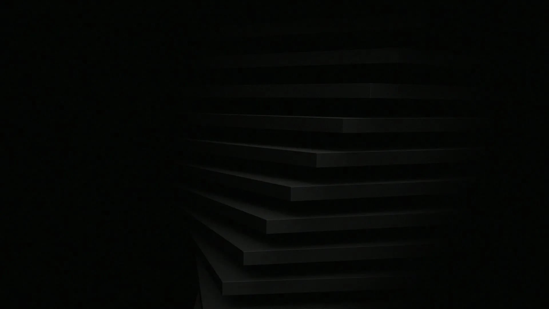 Dark abstract image with layered horizontal black surfaces and minimal visible lighting.