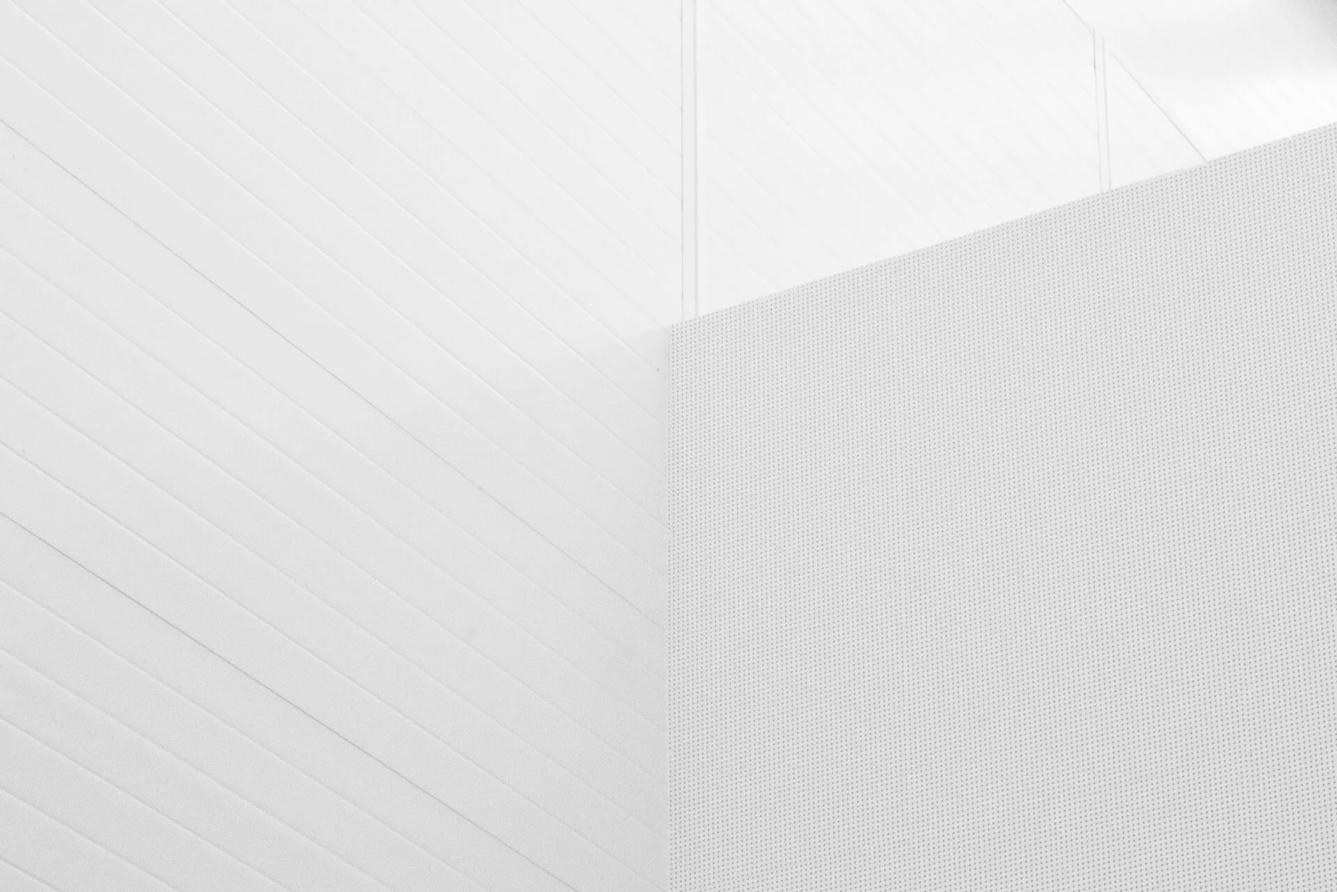 Subtle white textured background with diagonal stripes on the left and a dotted pattern on the right.