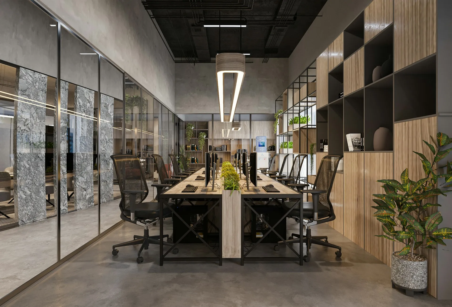 Open plan modern office with long shared desk, mesh chairs, plants, and glass meeting rooms.