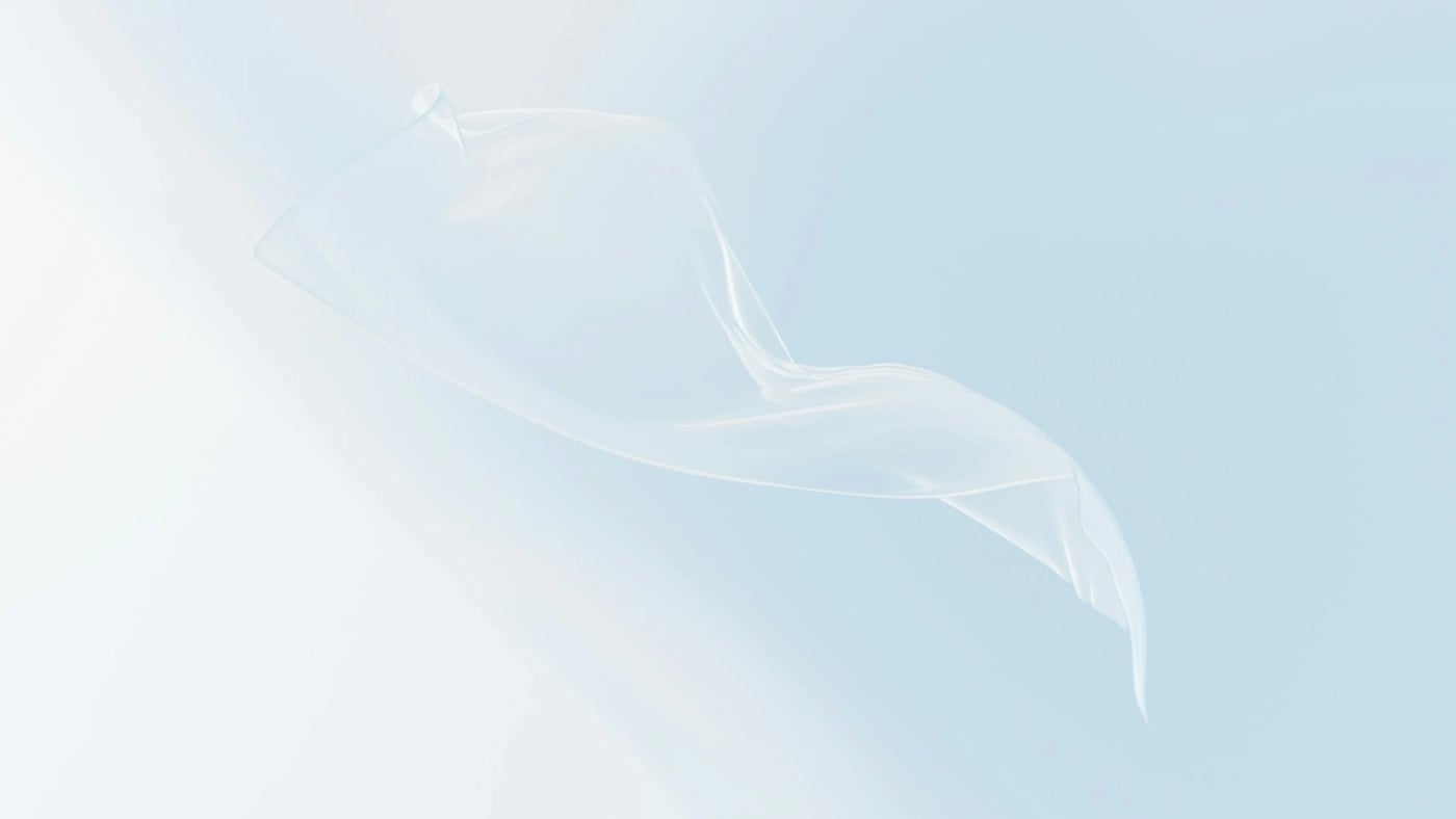 Transparent floating shape over soft blue background symbolising clarity, UX, and interface design in websites.