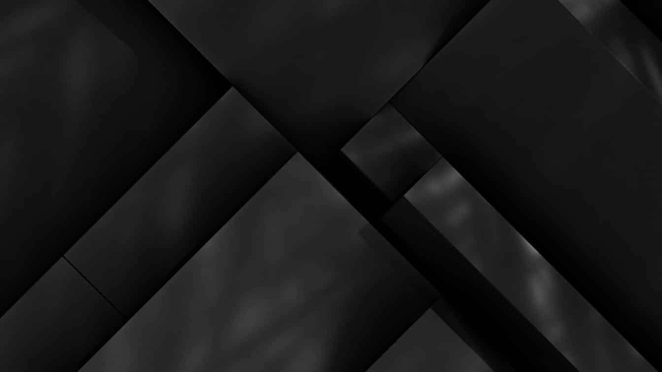 Dark overlapping geometric blocks symbolising digital architecture, data systems, and blockchain layers.