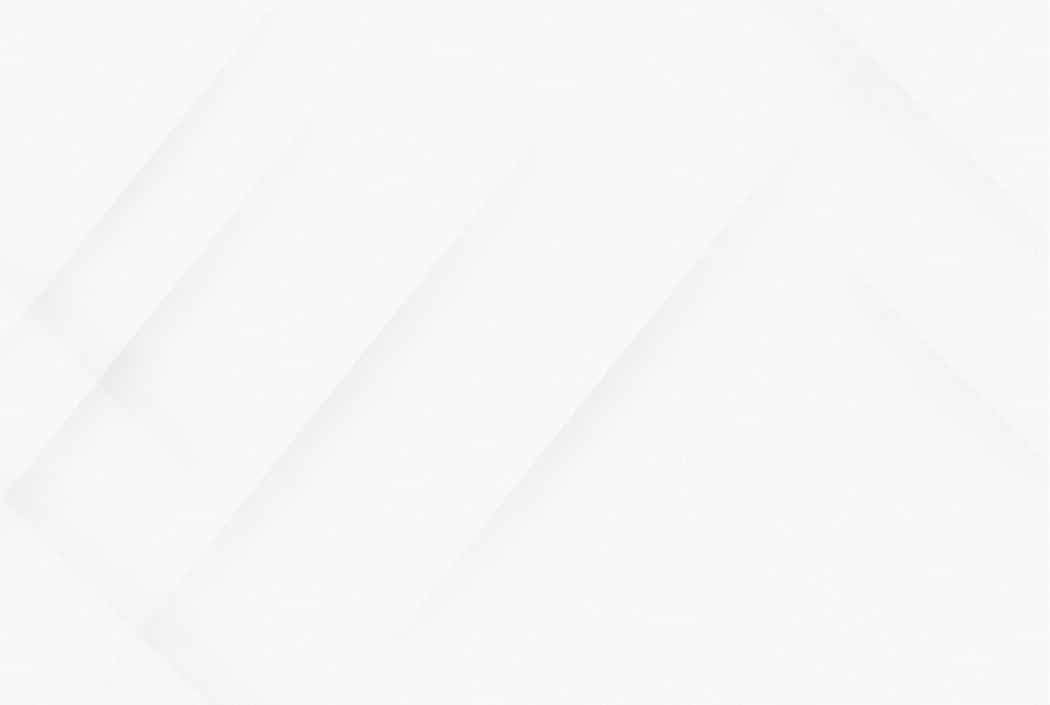 Abstract white geometric background with soft, diagonal lines.