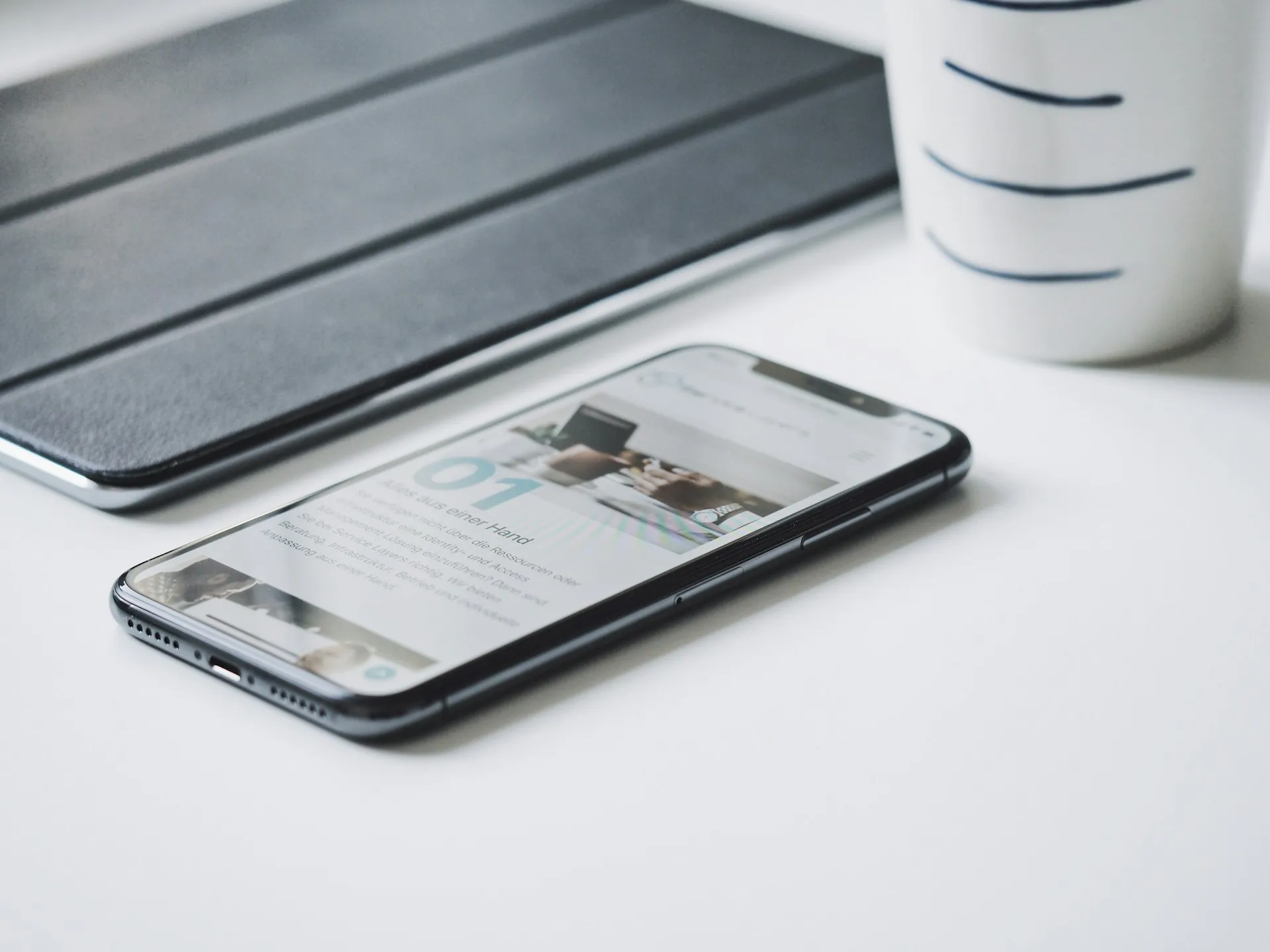 Modern responsive website displayed on multiple mobile devices showing adaptable design across different screen sizes.