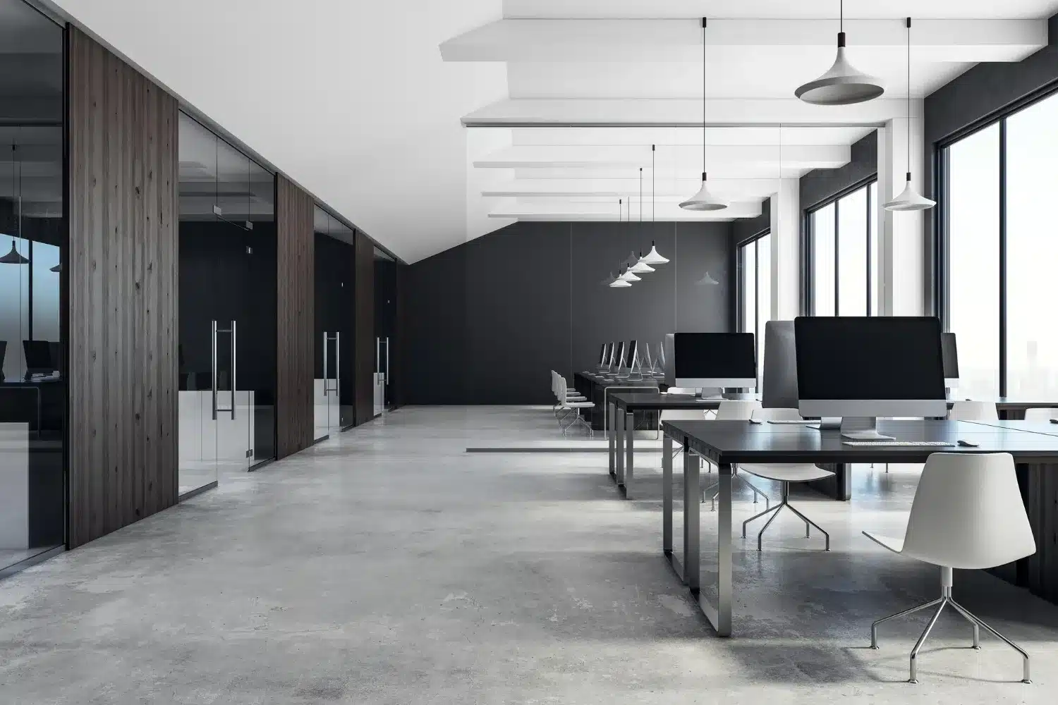 Minimalist open-plan office with sleek workstations, iMacs, glass meeting rooms, and floor-to-ceiling windows letting in natural light.