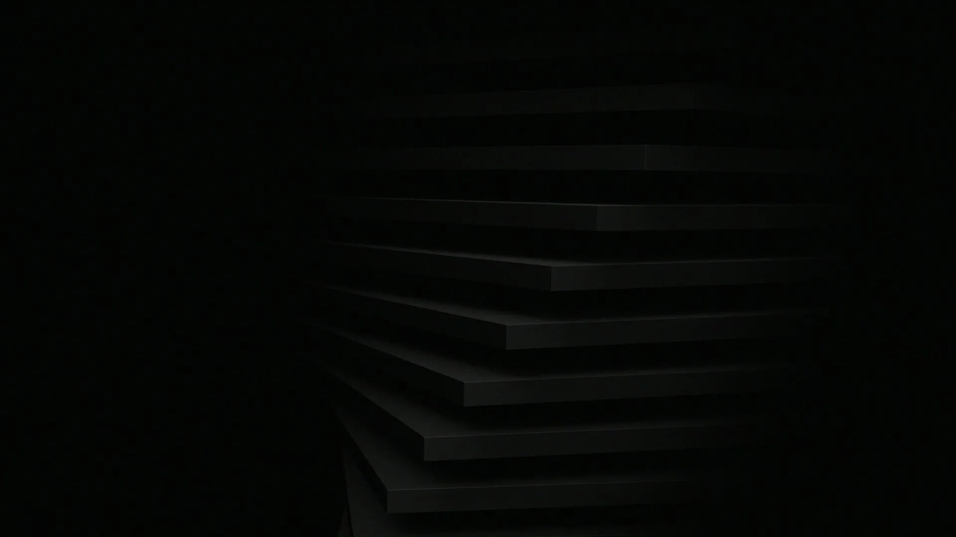 Dark abstract image with layered horizontal black surfaces and minimal visible lighting.