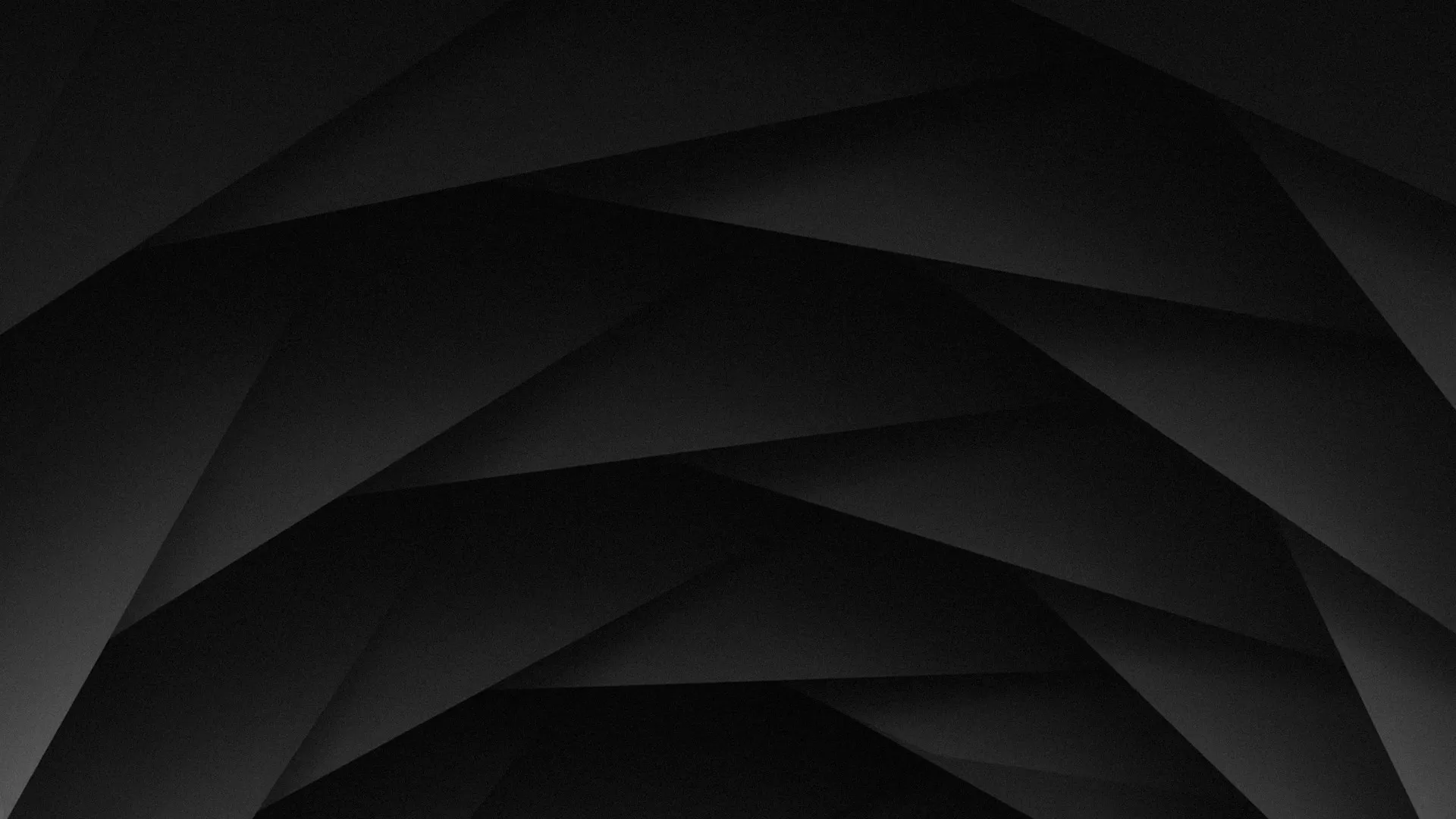 Dark abstract geometric background with layered triangular shapes.